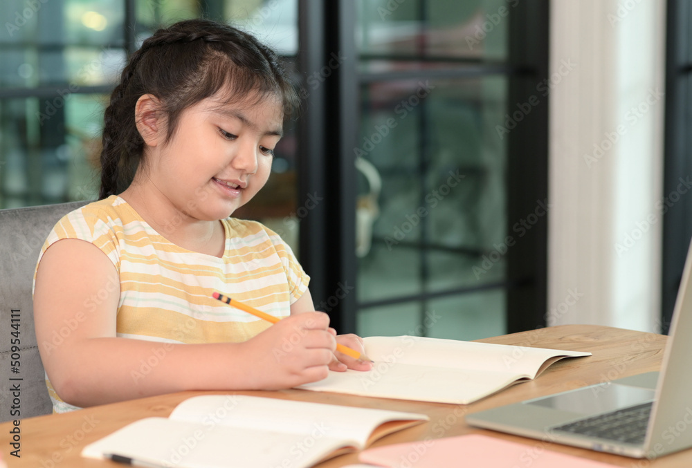 Asian girls are studying in tutoring, studying online at home, girls are bored and tired from tutoring. Asian girls are studying in tutoring, studying online at home, girls are bored and tired from tutoring.