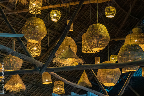 Wicker lanterns under a roof as a decor in restaurant in Nungwi, Zanzibar, Tanzania