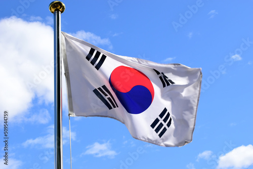 역동적으로 바람에 펄럭이고있는 한국의 국기인 태극기 photo