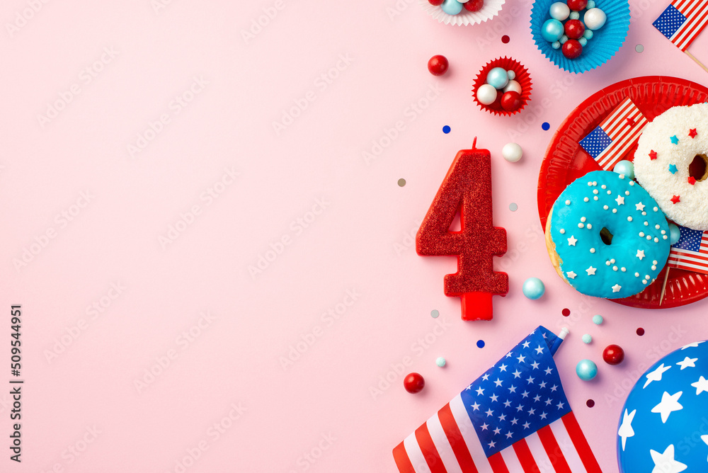 Obraz premium USA Independence Day concept. Top view photo of number 4 candle national flag paper molds with candies plate with glazed donuts balloon and confetti on isolated pastel pink background with empty space