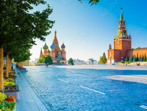 Spasskaya Tower of Moscow Kremlin and the Cathedral of Vasily the Blessed (Saint Basil's Cathedral) on Red Square in summer morning. Moscow. Russia