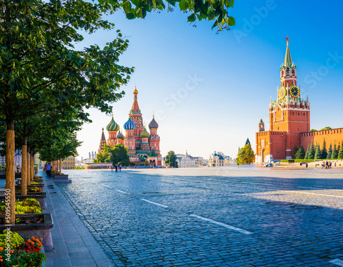 Spasskaya Tower of Moscow Kremlin and the Cathedral of Vasily the Blessed (Saint Basil's Cathedral) on Red Square in summer morning. Moscow. Russia