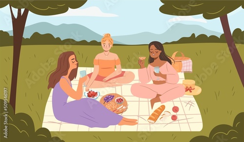 Happy girls on picnic in park. Friends having fun