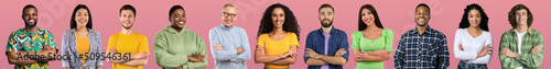 Beautiful international team posing on pink studio background, web-banner