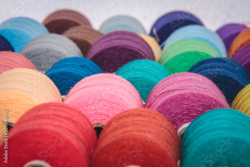 Foto Colourful threads from clothing factory