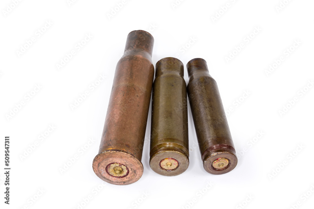 Spent shells from assault rifles different caliber on white background Spent shells from assault rifles different caliber on white background