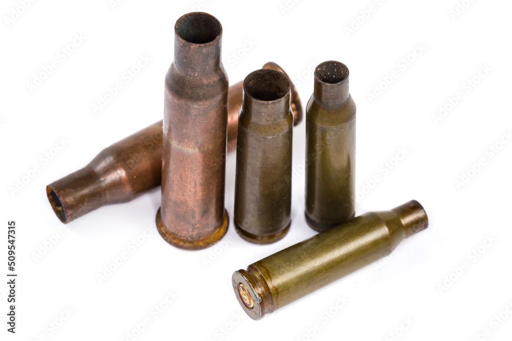 Spent shells from assault rifles different caliber in selective focus Spent shells from assault rifles different caliber in selective focus