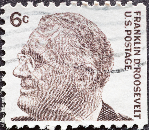 UNITED STATES - CIRCA 1966: a postage stamp from UNITED STATES , showing a portrait of the 32nd President of the United States , Franklin Delano Roosevelt (1882-1945) . Circa 1966 photo