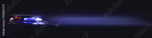 Red and blue light flasher. Police car at night time in the city