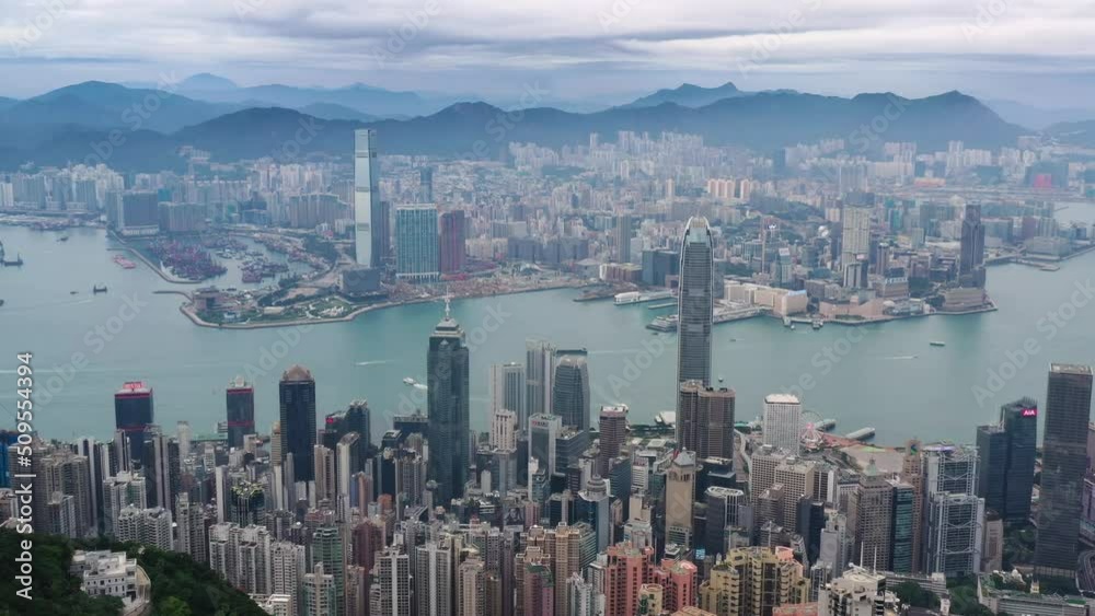 Aerial shot of Victoria Harbour along with Hong Kong cityscape city urban in morning scene.