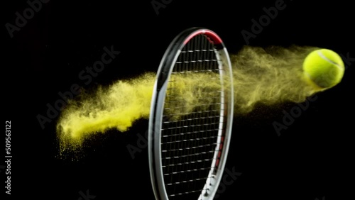 Super slow motion of hitting tenis ball with powder explosion. Filmed on high speed cinema camera, 1000fps. photo