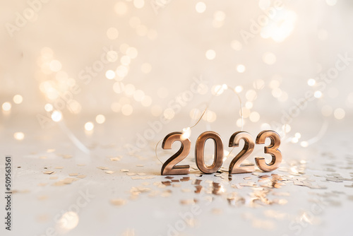 happy new year 2022 background new year holidays card with bright lights,gifts and bottle of hampagne photo