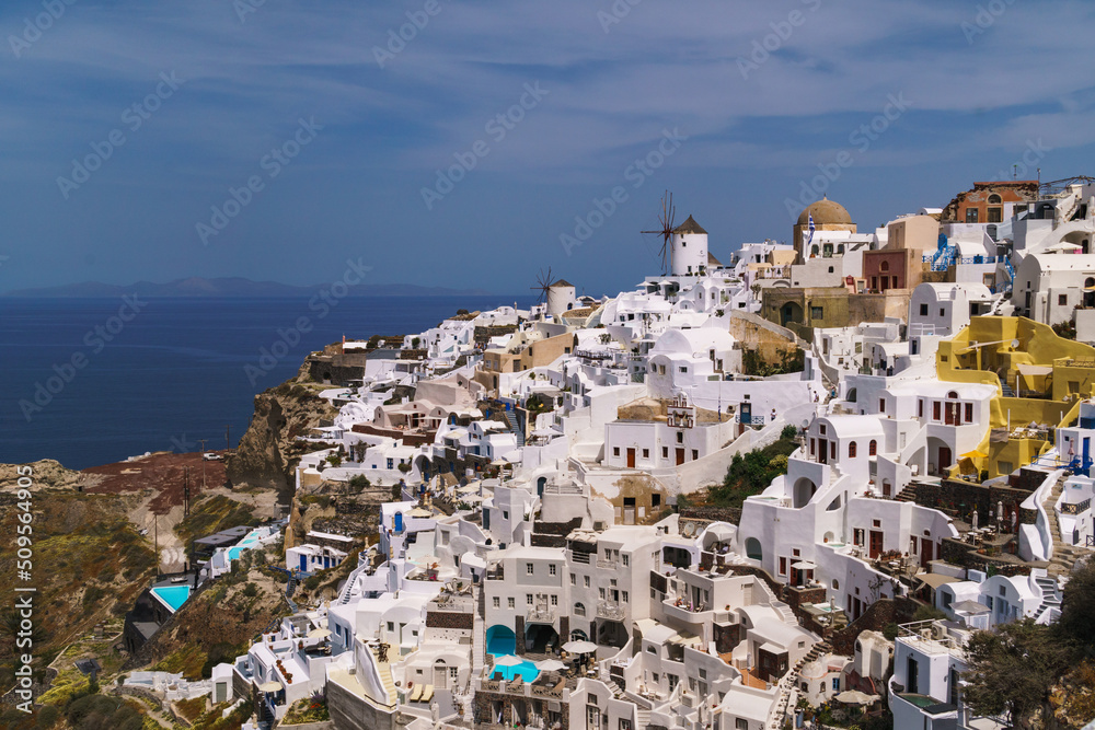Wide angle image of part of the town Oia in Santorini. Famous travel destination on the Greek island.