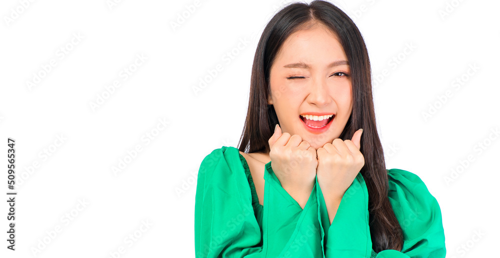 Attractive beautiful positive happy smile asian woman showing heart gesture and pose with empty space wearing green shirt and jeans, young gril with happy mood is excited. Attractive beautiful positive happy smile asian woman showing heart gesture and pose with empty space wearing green shirt and jeans, young gril with happy mood is excited.