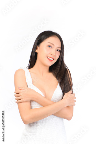 Portrait of young beautiful sexy asian woman wearing a white dress pose with empty space.