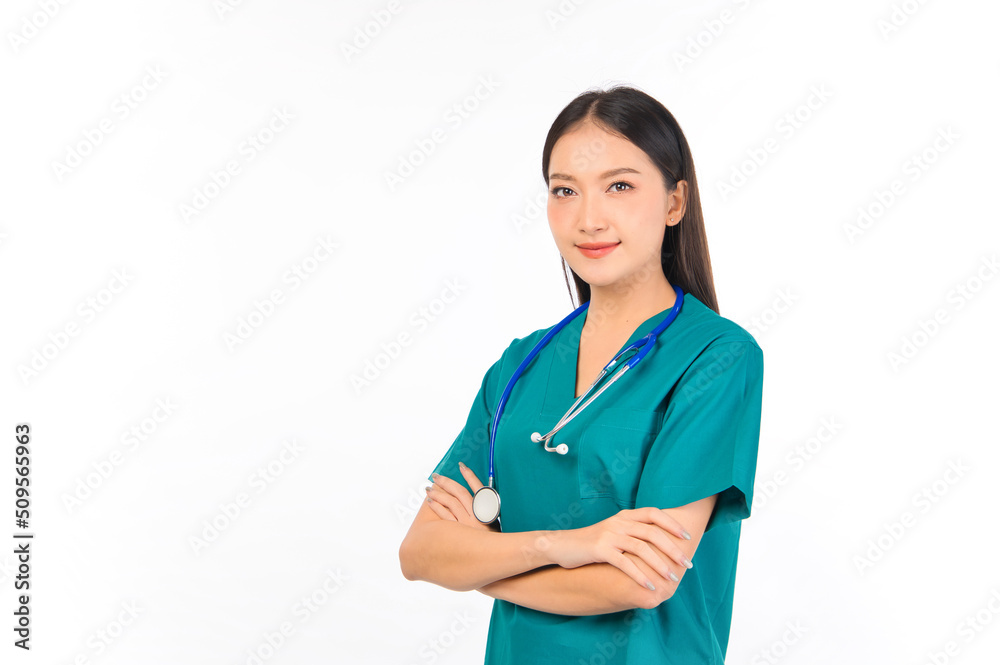 Portrait of professional confident young asian female smiling doctor in green scrubs doctor healthcare and doctors concept. Portrait of professional confident young asian female smiling doctor in green scrubs doctor healthcare and doctors concept.