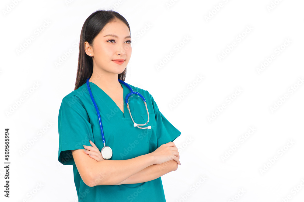 Portrait of professional confident young asian female smiling doctor in green scrubs doctor healthcare and doctors concept. Portrait of professional confident young asian female smiling doctor in green scrubs doctor healthcare and doctors concept.