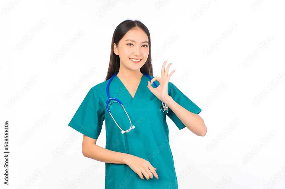 Portrait of professional confident young asian female smiling doctor in green scrubs showing OK sign , doctor healthcare and doctors concept. Portrait of professional confident young asian female smiling doctor in green scrubs showing OK sign , doctor healthcare and doctors concept.