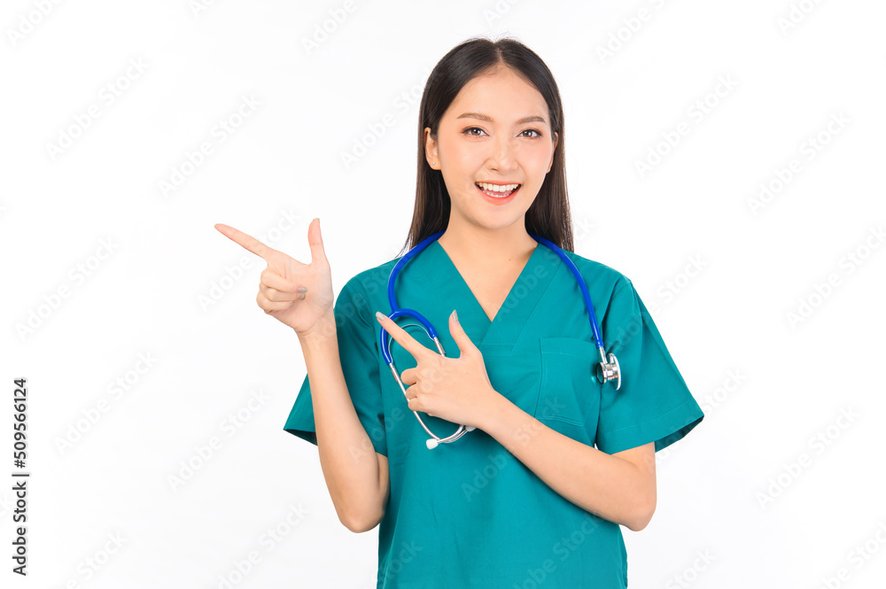 Portrait of professional confident young asian female smiling doctor in green scrubs showing presenting finger to empty space, doctor healthcare and doctors concept. Portrait of professional confident young asian female smiling doctor in green scrubs showing presenting finger to empty space, doctor healthcare and doctors concept.