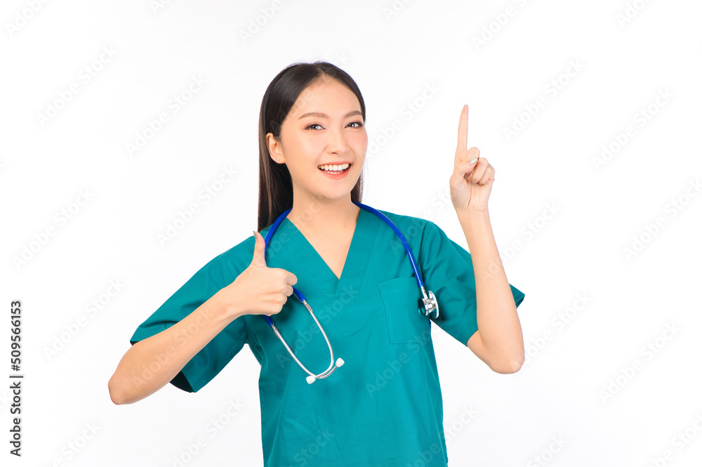 Portrait of professional confident young asian female smiling doctor in green scrubs showing presenting finger to empty space, doctor healthcare and doctors concept. Portrait of professional confident young asian female smiling doctor in green scrubs showing presenting finger to empty space, doctor healthcare and doctors concept.