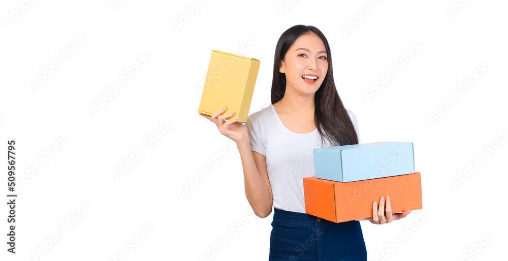 Happy cute asian woman smiling and holding package online marketing and delivery Start a small business at home on white background, Delivery shipping service concept. Happy cute asian woman smiling and holding package online marketing and delivery Start a small business at home on white background, Delivery shipping service concept.
