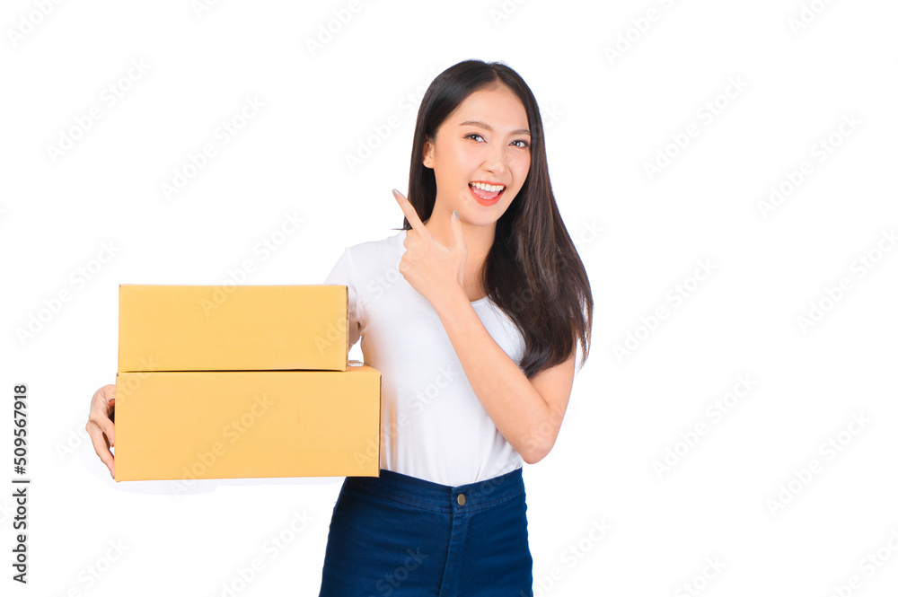 Happy cute asian woman smiling and holding package online marketing and delivery Start a small business at home on white background, Delivery shipping service concept. Happy cute asian woman smiling and holding package online marketing and delivery Start a small business at home on white background, Delivery shipping service concept.