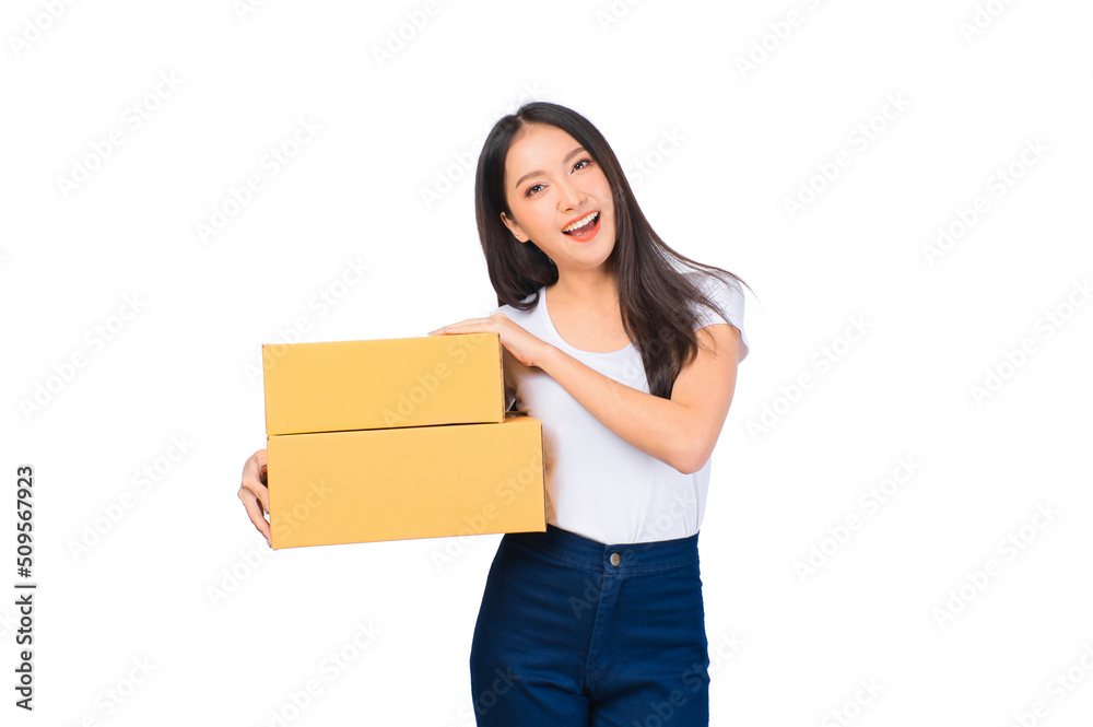Happy cute asian woman smiling and holding package online marketing and delivery Start a small business at home on white background, Delivery shipping service concept. Happy cute asian woman smiling and holding package online marketing and delivery Start a small business at home on white background, Delivery shipping service concept.