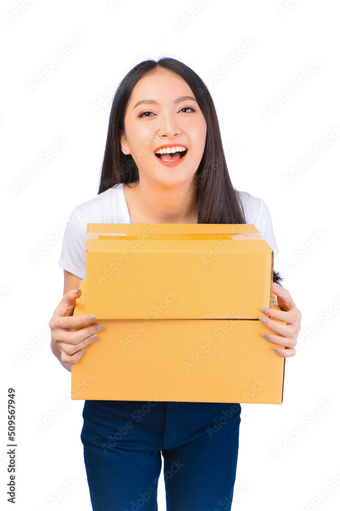 Happy cute asian woman smiling and holding package online marketing and delivery Start a small business at home on white background, Delivery shipping service concept. Happy cute asian woman smiling and holding package online marketing and delivery Start a small business at home on white background, Delivery shipping service concept.