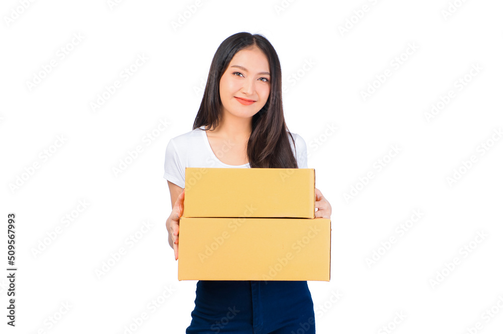Happy cute asian woman smiling and holding package online marketing and delivery Start a small business at home on white background, Delivery shipping service concept. Happy cute asian woman smiling and holding package online marketing and delivery Start a small business at home on white background, Delivery shipping service concept.