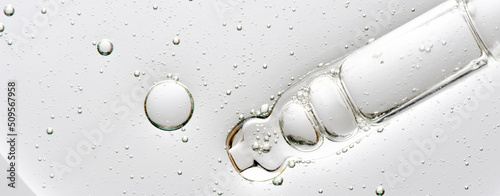 The texture of a cosmetic serum with a pipette closeup. Macrophotography photo