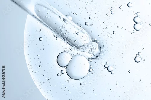 Obraz The texture of a cosmetic serum with a pipette closeup. Macrophotography