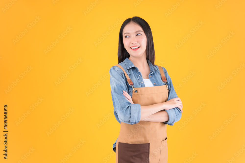 pretty asian female smile coffee freelancer own shop ands point up and pose to copy space yellow background. pretty asian female smile coffee freelancer own shop ands point up and pose to copy space yellow background.