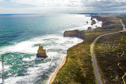 Aerial view on a sunny day with clouds of 12 apostles along the Great Ocean Road, Victoria, Australia photo