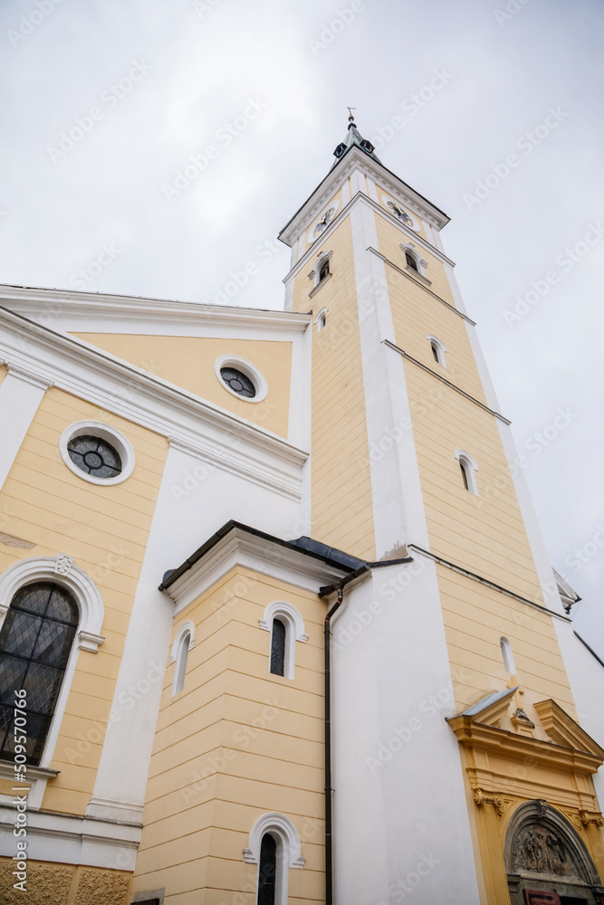 Jesenik, Moravia, Czech Republic, 15 April 2022: Church of the Assumption of the Virgin Mary with bell tower at spa city at spring sunny day, Easter time