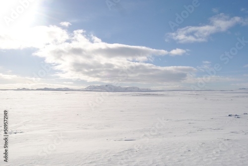 snowy landscape with blue sky and clouds © Pelayo