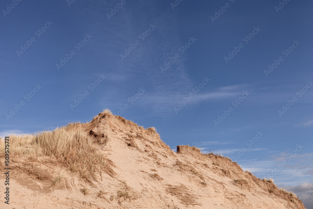 Sand dune at braunton burrrows, UK against blue sky Sand dune at braunton burrrows, UK against blue sky