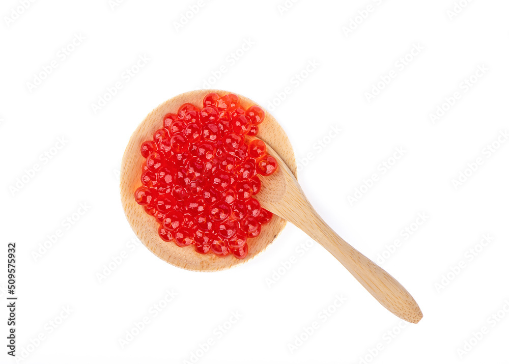 Serving wooden mini plate and mini spoon with red caviar isolated on white background. Serving wooden mini plate and mini spoon with red caviar isolated on white background.