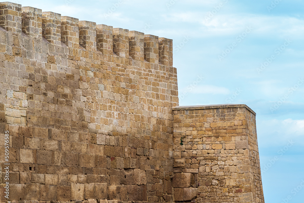 battlements of a medieval fortress against the sky, Naryn-Kala citadel in Derbent