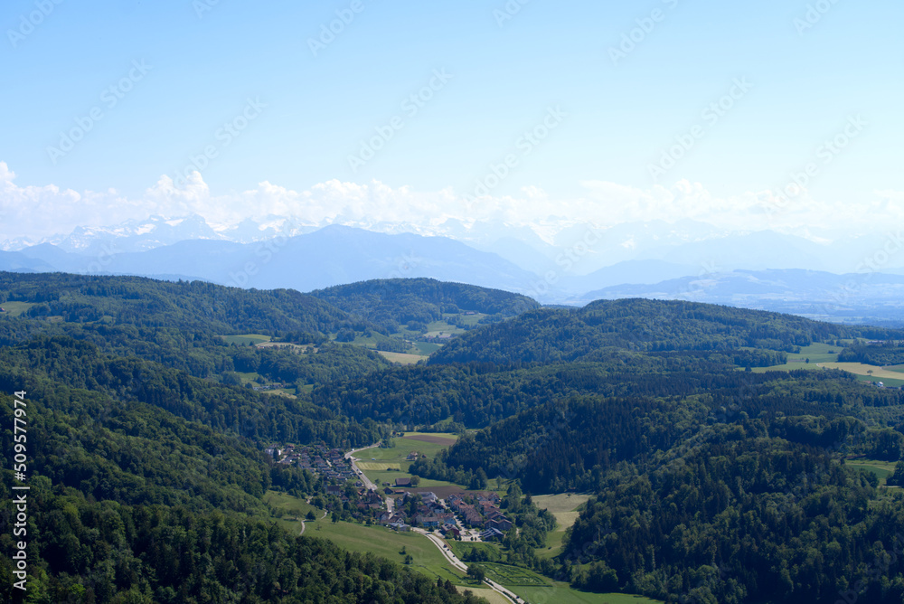 Aerial view of Canton Zürich with village Stallikon in the background seen from local mountain Uetliberg on a sunny spring day. Photo taken May 18th, 2022, Zurich, Switzerland.