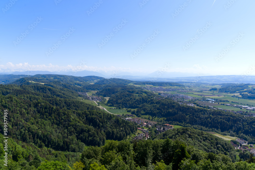 Aerial view of Canton Zürich with village Stallikon in the background seen from local mountain Uetliberg on a sunny spring day. Photo taken May 18th, 2022, Zurich, Switzerland.