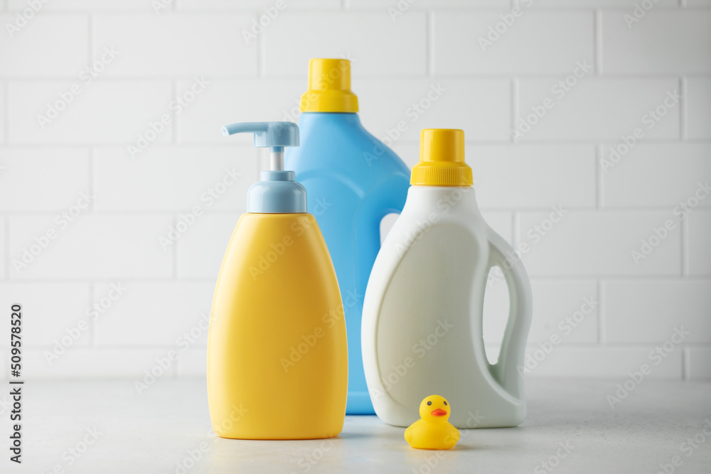 Mockups of natural cosmetics for bathing a child, washing baby clothes. Washing gel and conditioner for sensitive skin Mockups of natural cosmetics for bathing a child, washing baby clothes. Washing gel and conditioner for sensitive skin