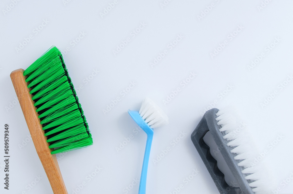 Three cleaning brushes handle. White background.