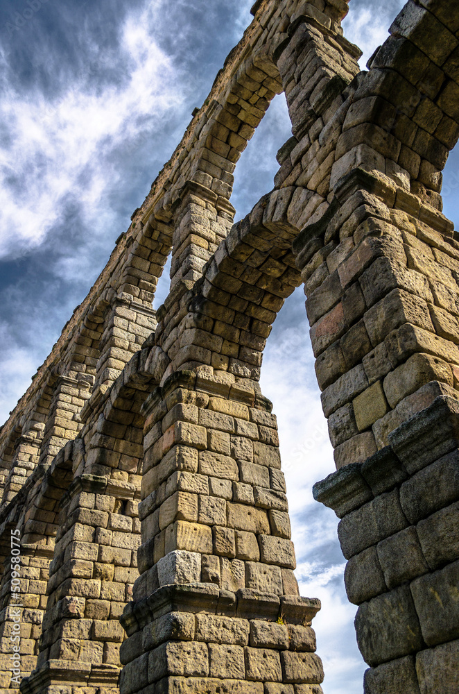 Strolling under the Roman aqueduct of Segovia