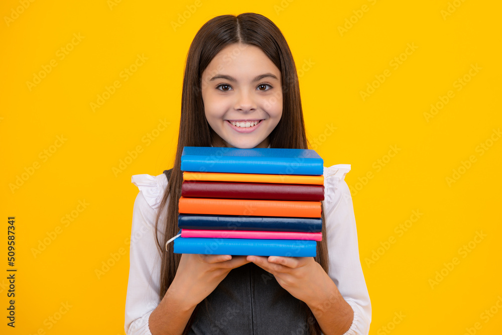 Schoolgirl with copy book posing on isolated background. Literature lesson, grammar school. Intellectual child reader. Schoolgirl with copy book posing on isolated background. Literature lesson, grammar school. Intellectual child reader.
