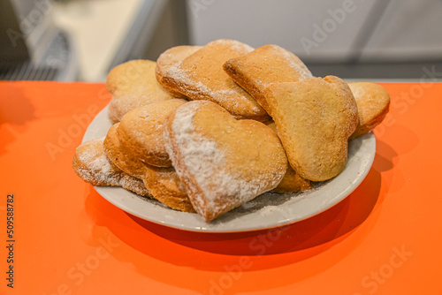 Cookies on a plate. Heart-shaped cookies. Cookies sprinkled with sugar pollen on the bar. Ukraine. Kyiv. May 19, 2016