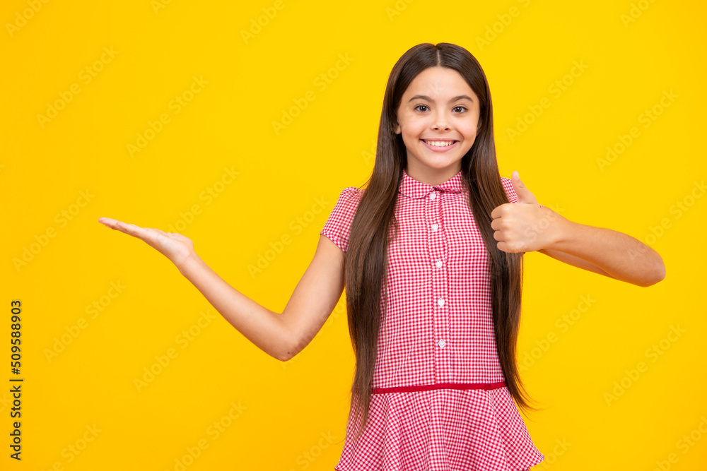 Teenager child pointing to the side with a finger to present a product or idea. Teen girl in casual outfit pointing empty space. Teenager child pointing to the side with a finger to present a product or idea. Teen girl in casual outfit pointing empty space.