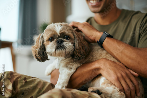 Canvastavla Cute shih tzu dog and his owner enjoying at home.