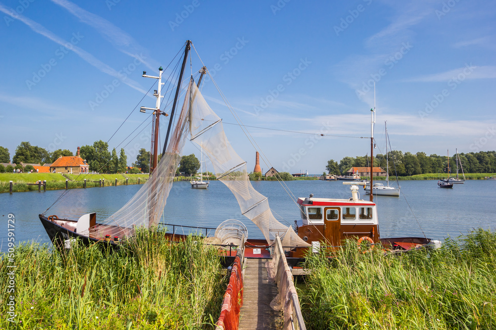 Fishing boat at a jetty in historic city Enkhuizen, Netherlands