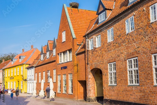 Red brick historic buildings in the central street of Ribe, Denmark