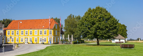 Принти на полотні Panorama of a colorful yellow house in Jelling, Denmark